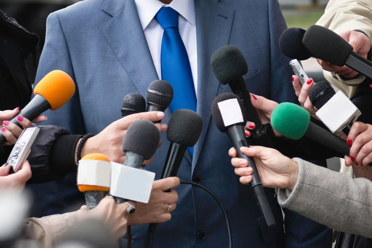 Journalist with microphone and camera crew covering the European Choir Games